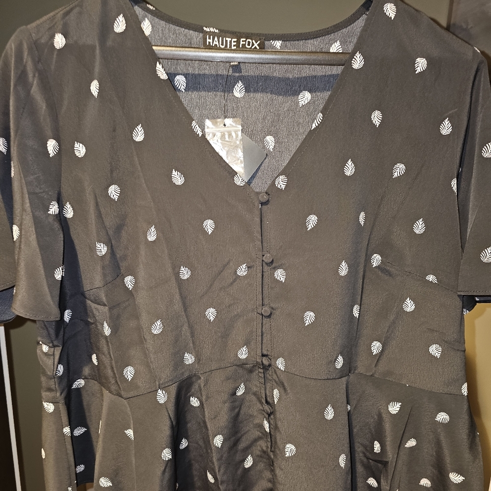 NWT Black Peplum Top with subtle white feather print. Womens Business